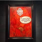 Animal rights activists have targeted King Charles’ first official portrait by pasting the animated character Wallace over his face.
