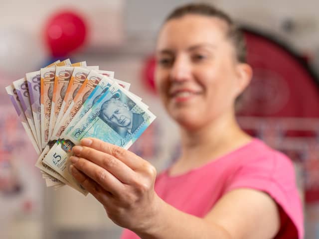London tourist Paula Cavelius with the new-look banknotes bearing a portrait of King Charles III (Photo: Jas Lehal/PA Media Assignments)