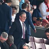 Sir Keir Starmer watches Arsenal in action against Manchester United.