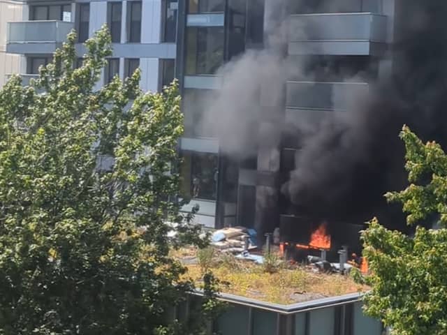 Fire rages at 22-storey tower block.