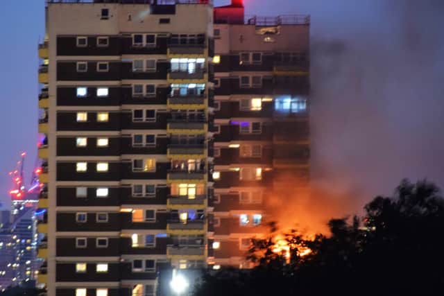 Bright orange flames can be seen coming from the 10th floor of a tower block in North Woolwich