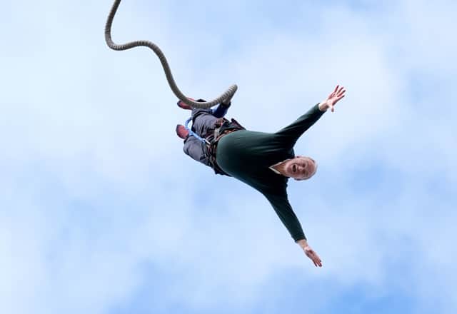 Lib Dem leader Sir Ed Davey took part in a bungee jump during a visit to Eastbourne Borough Football Club in East Sussex on Monday. 