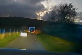 Passenger hurls freezer from van door during police chase in South Wales.