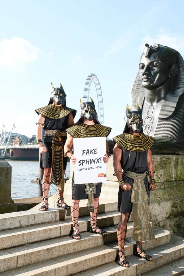 Performers dressed as the ancient Egyptian god Anubis surprise London commuters.