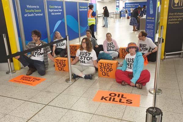 Just Stop Oil supporters who blocked departure gates at Gatwick Airport using “suitcases with lock-on devices” have been arrested and are being removed, the airport has said. (Photo: Just Stop Oil/PA Wire)