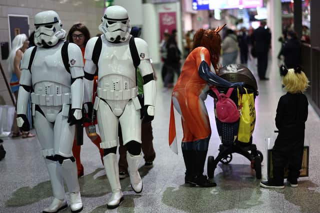 Cosplayers attend the MCM Comic Con at ExCeL exhibition centre in London on October 27, 2023. (Photo by HENRY NICHOLLS / AFP)