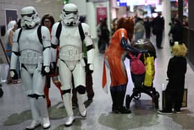 Cosplayers attend the MCM Comic Con at ExCeL exhibition centre in London on October 27, 2023. (Photo by HENRY NICHOLLS / AFP) 