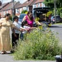 Grace Hills, 36, transformed her street from a 'neglected patch of urban land' into a colourful wildflowers. 