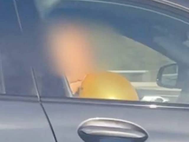 BMW driver filmed inhaling from what appeared to be a 'hippy crack balloon' on the M6.