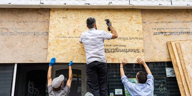 Shops on Old Market Road and West Street in Bristol board up their windows and close early amid planned far-right protests.