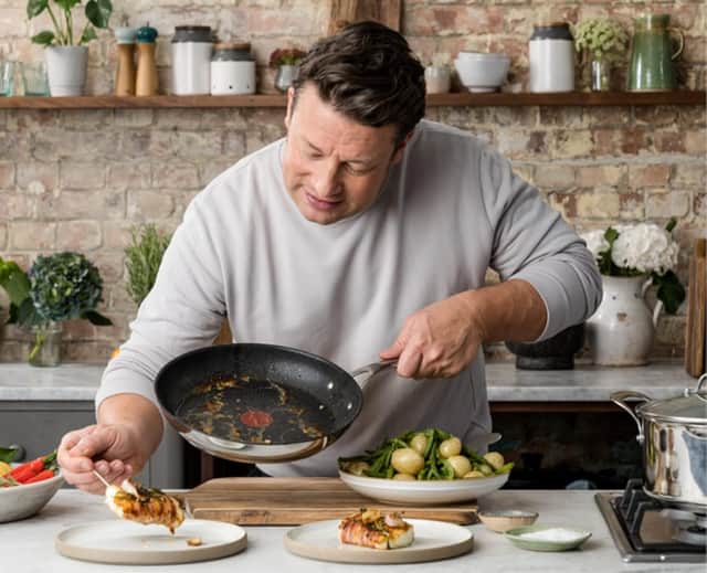 Tefal Jamie Oliver Cook's Direct Stainless Steel Frying Pan in action with the celebrity chef