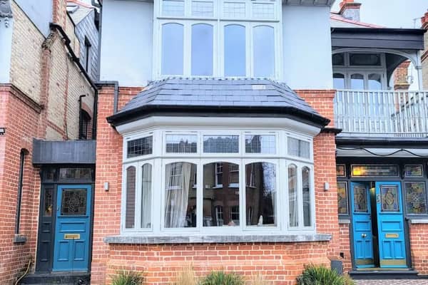Bright blue doors and a stunning balcony are all idyllic features of this Compton Road house for sale. 