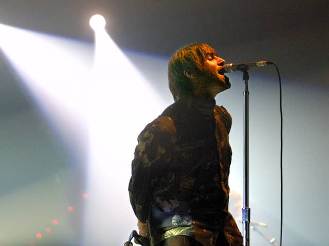 Oasis rock group performs during a concert, late 20 November 2002 in Spain. Photo: RAFA RIVAS/AFP via Getty Images