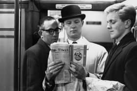 On the London Underground a commuter reads a copy of D H Lawrence's 'Lady Chatterley's Lover', unaware of the fellow passengers surreptitiously reading over his shoulder, 3rd November 1960