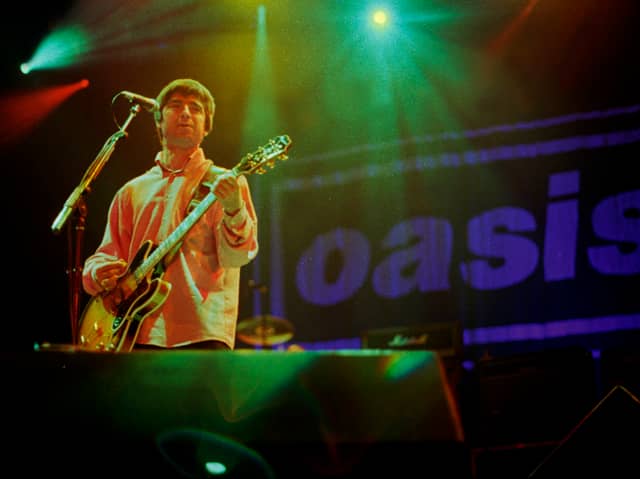 Noel Gallagher of Oasis performs on stage. Photo: Stacia Timonere/Getty Images