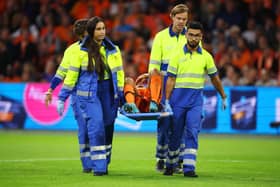 Nathan Ake is carried off on a stretcher against Germany.