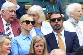 Dave Grohl, and his wife Jordyn Grohl are seen in the Royal Box at Wimbledon earlier this year