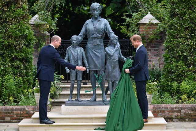 The then Duke of Cambridge (left) and the Duke of Sussex unveiling a statue they commissioned of their mother Diana, Princess of Wales, in the Sunken Garden at Kensington Palace, London, on what would have been her 60th birthday.