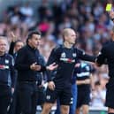 Fulham boss Marco Silva is shown a yellow card against West Ham.