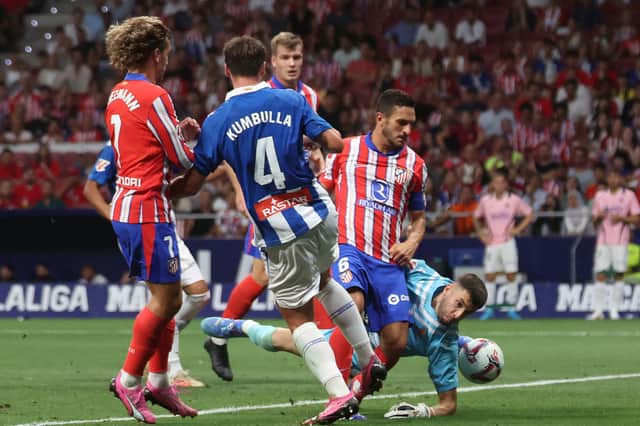 Espanyol goes to save during league football match against Atletico Madrid