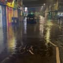 Video footage shows a street in south London submerged in water after overnight rainfall.
