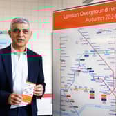 The mayor of London, Sadiq Khan with the new London Overground map