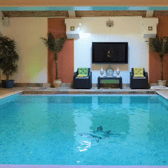 The stunning indoor swimming pool fitted with a surround sound system