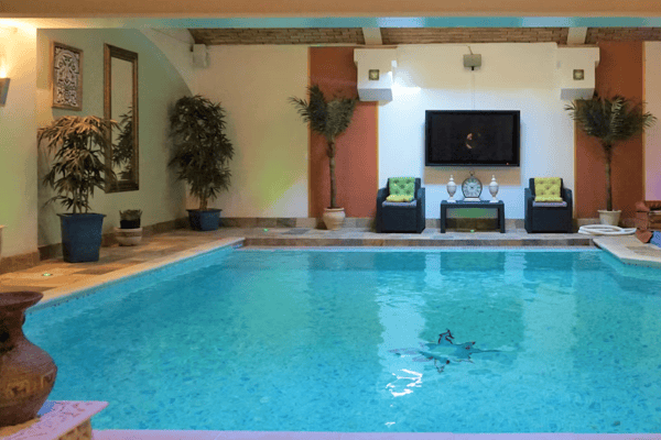 The stunning indoor swimming pool fitted with a surround sound system