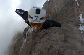 Wingsuit jumper Tim Howell leaps off Mount Kilimanjaro at 5,450m.