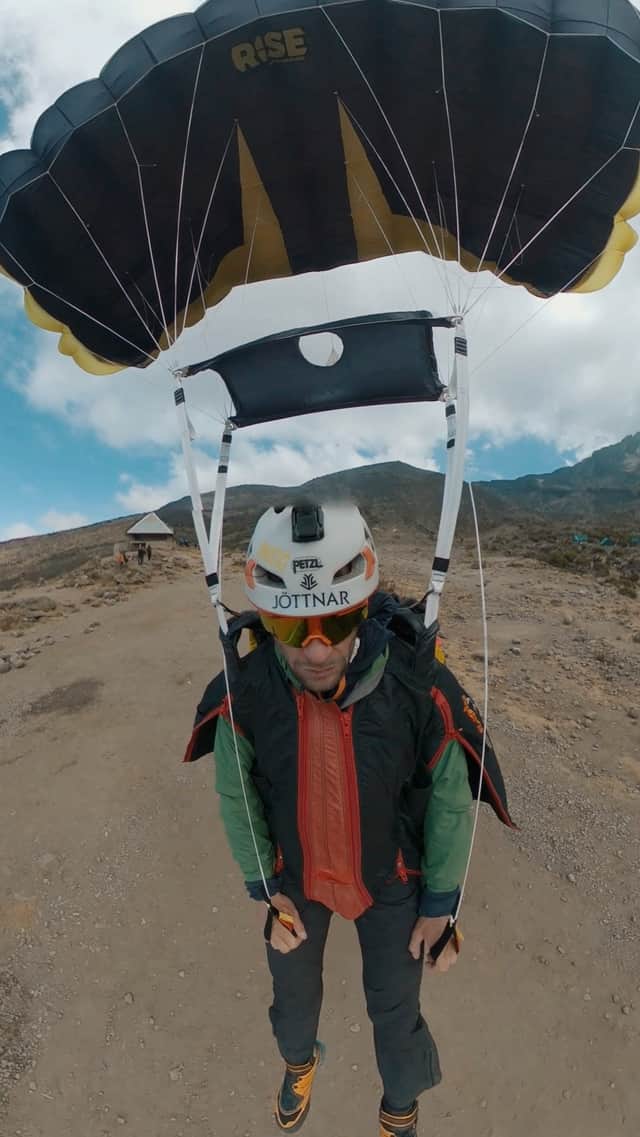 Video grab of Tim Howell flying off Mount Kilimanjaro in a wingsuit.