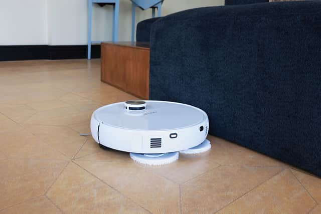 The robot attaches and detaches its own mops, depending on the job it's being asked to do