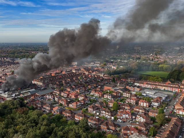 Aerial images show fire fighters tackling flames of a huge fire in Manchester 