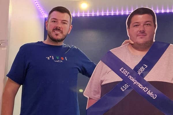 A former secret eater celebrated his 12 stone weight loss with a CARDBOARD CUT OUT showing his former XXXXL frame.