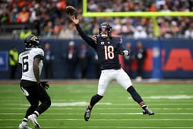 aleb Williams of Chicago Bears catches the ball under pressure from Darnell Savage of Jacksonville Jaguars during the NFL match between Jacksonville Jaguars and Chicago Bears at Tottenham Hotspur Stadium on October 13, 2024