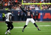 aleb Williams of Chicago Bears catches the ball under pressure from Darnell Savage of Jacksonville Jaguars during the NFL match between Jacksonville Jaguars and Chicago Bears at Tottenham Hotspur Stadium on October 13, 2024