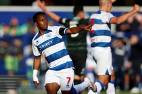 Kader Dembele celebrates scoring his side's first goal against Pompey at Loftus Road 