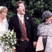 Alex and Sue Tatham on their wedding day with Cilla Black.