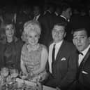 Frances Shea (1943 - 1967, far left) and her husband, English gangster Reggie Kray (1933 - 2000, far right) with actress Barbara Windsor and her husband Ronnie Knight, an associate of the Krays, at the El Morocco nightclub, owned by the Kray Twins in Soho, London, 30th April 1965.