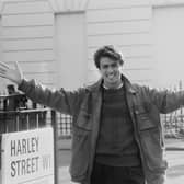 English singer George Michael (1963-2016) of the music duo Wham! pictured standing on the corner of Harley Street in London on 11th November 1983. 