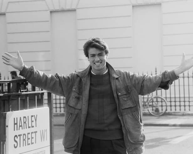 English singer George Michael (1963-2016) of the music duo Wham! pictured standing on the corner of Harley Street in London on 11th November 1983. 