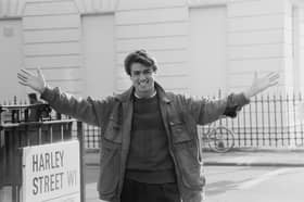 English singer George Michael (1963-2016) of the music duo Wham! pictured standing on the corner of Harley Street in London on 11th November 1983. 