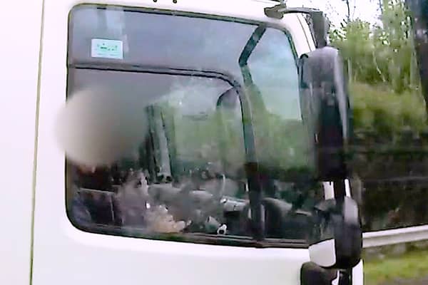 Shocking footage shows HGV driver caught eating yoghurt at the wheel