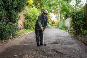 Furious resident Douglas Debnam on Whitebarns Lane in the village of Furneaux Phelham in Hertfordshire, is embroiled in Britain's longest running pothole row.