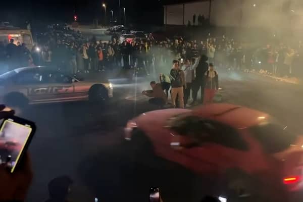 Video shows a man drifting then crashing with parked cars as well as injuring a member of the public.