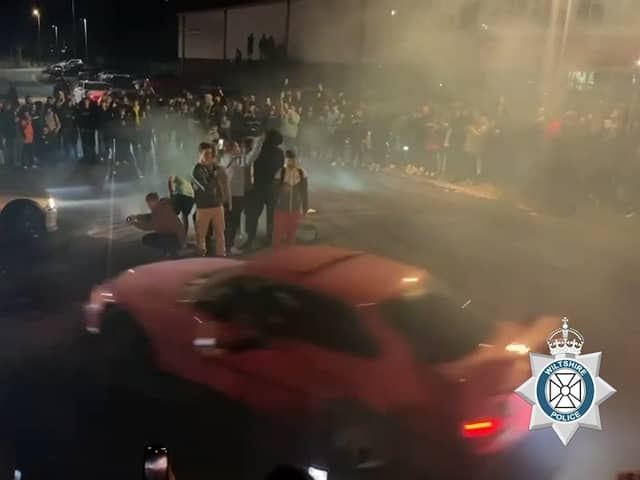Video shows a man drifting then crashing with parked cars as well as injuring a member of the public.