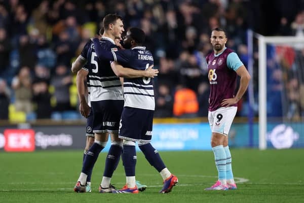 Jake Cooper and Japhet Tanganga of Millwall celebrate victory against Burnley