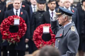 King Charles III salutes as he stands before the Cenotaph on Remembrance Sunday on November 12, 2023 in London. 