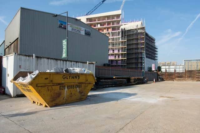 The site is currently occupied by a skip and waste management company