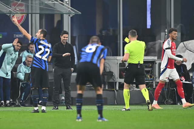 Mikel Arteta is shown a yellow card against Inter Milan.