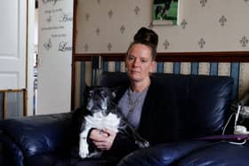 Trevvena Prince, pictured with her dog Bullet, had to move out as she feared a problem with her washing machine could set fire to the house